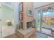 Brick fireplace with access to the bedroom and a screened-in porch at 4545 Southfield Ave, Orlando, FL 32812