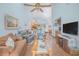 Spacious living room with high ceilings, wood floors, and comfortable seating at 4545 Southfield Ave, Orlando, FL 32812