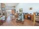 Cozy living room featuring wood floors, a fireplace, and sliding doors to the outdoor space at 4545 Southfield Ave, Orlando, FL 32812