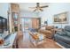Inviting living room with a brick fireplace, wood floors, and cozy furnishings at 4545 Southfield Ave, Orlando, FL 32812
