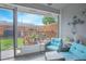 Relaxing screened porch with wicker furniture overlooking the fenced backyard at 4545 Southfield Ave, Orlando, FL 32812