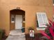 Close up of the home entrance, with a well-lit doorway and a charming 'welcome' sign at 4778 Vero Beach Pl, Kissimmee, FL 34746