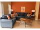 Comfortable living room with stylish sofas and a cozy ambiance, perfect for relaxation and casual gatherings at 4778 Vero Beach Pl, Kissimmee, FL 34746