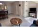 Inviting living room with tile floors, neutral walls, and comfortable seating adjacent to the dining and kitchen area at 4778 Vero Beach Pl, Kissimmee, FL 34746