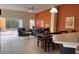 Open-concept living room with tile flooring, comfortable seating, and sliding glass doors offering seamless indoor-outdoor living at 4778 Vero Beach Pl, Kissimmee, FL 34746