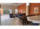 Spacious living room with tile flooring, modern furnishings, and ample natural light with sliding glass doors at 4778 Vero Beach Pl, Kissimmee, FL 34746