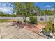 View of the spacious backyard showing trees, plants, and patio at 517 Ivanhoe Way, Casselberry, FL 32707
