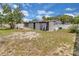 Aerial view of the backyard, showcasing the patio, lawn, and property boundaries at 517 Ivanhoe Way, Casselberry, FL 32707