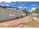 View of the backyard featuring a brick patio, lawn mower, and storage shed at 517 Ivanhoe Way, Casselberry, FL 32707