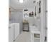 Bathroom with shower stall, sink and washer and dryer at 517 Ivanhoe Way, Casselberry, FL 32707