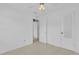 Empty bedroom with tiled floor, a ceiling fan, and two access doors at 517 Ivanhoe Way, Casselberry, FL 32707