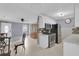 Open-concept kitchen with white cabinets and modern appliances at 517 Ivanhoe Way, Casselberry, FL 32707