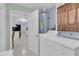 Laundry area featuring a washer, dryer, and hot water heater at 517 Ivanhoe Way, Casselberry, FL 32707