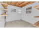 Room features tile flooring, multiple windows, shelves, and a white block wall at 517 Ivanhoe Way, Casselberry, FL 32707