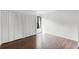 Bedroom featuring hardwood floors, a closet and a window at 5301 Burning Tree Dr # F, Orlando, FL 32811