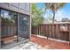 Ground level outdoor patio with sliding glass door and privacy fence at 5301 Burning Tree Dr # F, Orlando, FL 32811