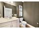 Modern powder room featuring a sleek vanity, minimalist decor, and stylish fixtures at 5550 Sabal Dr, St Cloud, FL 34771