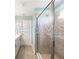 Elegant bathroom showcasing a large glass shower with sleek fixtures and neutral tile design at 5550 Sabal Dr, St Cloud, FL 34771