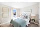 Serene bedroom with soft colors, comfortable bedding, and bright natural light at 5550 Sabal Dr, St Cloud, FL 34771