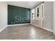 Spacious bedroom with a modern accent wall and bright, natural light at 5550 Sabal Dr, St Cloud, FL 34771