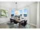 Elegant dining room with lots of natural light, table and lake view at 5550 Sabal Dr, St Cloud, FL 34771