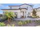 Attractive home boasting a stone entrance, brick walkway, landscaping and a two-car garage at 5550 Sabal Dr, St Cloud, FL 34771