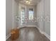 An empty foyer is illuminated by a hanging light fixture at 5550 Sabal Dr, St Cloud, FL 34771
