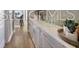 Kitchen with white cabinetry, recessed lighting, and laminate flooring at 5550 Sabal Dr, St Cloud, FL 34771