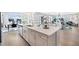 Gorgeous kitchen island with white cabinetry and quartz countertops at 5550 Sabal Dr, St Cloud, FL 34771