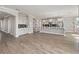 Open-concept living area with hardwood floors and abundant natural light at 5550 Sabal Dr, St Cloud, FL 34771