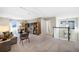 Bright, open living room with cozy seating, stylish decor, and scenic views from the windows at 5550 Sabal Dr, St Cloud, FL 34771