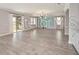 A bright living room is illuminated by a chandelier hanging from the ceiling at 5550 Sabal Dr, St Cloud, FL 34771
