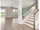 A staircase leads into the naturally lit living room at 5550 Sabal Dr, St Cloud, FL 34771