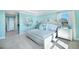 Bright main bedroom featuring tray ceiling, plush bed, and stylish bedside tables at 5550 Sabal Dr, St Cloud, FL 34771