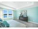 Bright bedroom with large windows, lake view, and stylish furniture at 5550 Sabal Dr, St Cloud, FL 34771