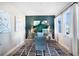 Charming home office with patterned chair, striking wall art, and serene natural lighting at 5550 Sabal Dr, St Cloud, FL 34771