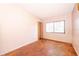 Cozy bedroom with parquet floors, a window, and ample closet space at 5604 Astoria Pl, Orlando, FL 32808