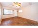 Open living space with parquet floors, large windows, and ample natural light at 5604 Astoria Pl, Orlando, FL 32808