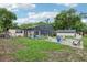 A backyard view with a screened pool, patio, and green grass at 618 Acapulca Way, Altamonte Springs, FL 32714