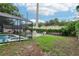 Backyard with screened pool and partially fenced yard at 618 Acapulca Way, Altamonte Springs, FL 32714