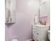 Bathroom featuring a toilet, vanity with drawers, mirror, and pink walls at 618 Acapulca Way, Altamonte Springs, FL 32714