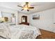 Bedroom with a large bed, ceiling fan, dresser, and mirrored closet doors at 618 Acapulca Way, Altamonte Springs, FL 32714