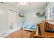 Bedroom features a piano, bright window, and a ceiling fan with lighting at 618 Acapulca Way, Altamonte Springs, FL 32714