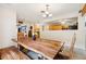 Bright dining area with wooden table, chairs, and view to the kitchen at 618 Acapulca Way, Altamonte Springs, FL 32714