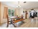 View of the dining room with a wood dining table and view into the living room at 618 Acapulca Way, Altamonte Springs, FL 32714