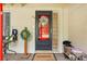 Eye-level shot of front door, decorated with a wreath and a welcome mat for an inviting entrance at 618 Acapulca Way, Altamonte Springs, FL 32714