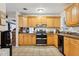 Spacious kitchen featuring wood cabinets and stainless-steel appliances at 618 Acapulca Way, Altamonte Springs, FL 32714