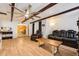 Living room showing open layout, hardwood floors, wood beams, and abundant light at 618 Acapulca Way, Altamonte Springs, FL 32714