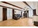 Open living room showcasing the hardwood floor, ceiling beams, and natural light at 618 Acapulca Way, Altamonte Springs, FL 32714