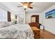 Main bedroom includes dresser, trunk, wall-mounted TV, and ceiling fan at 618 Acapulca Way, Altamonte Springs, FL 32714